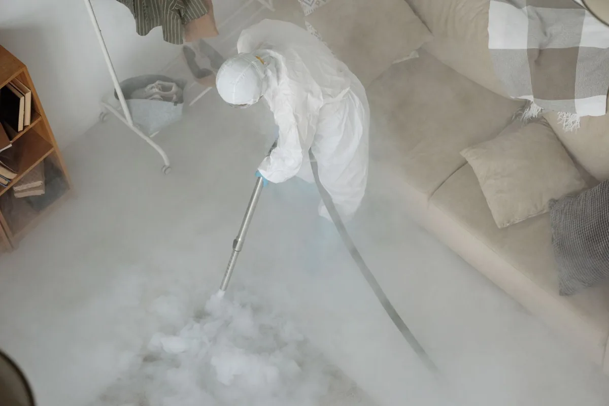 Biohazard cleanup technician in protective equipment, Santa Rita Ranch, TX
